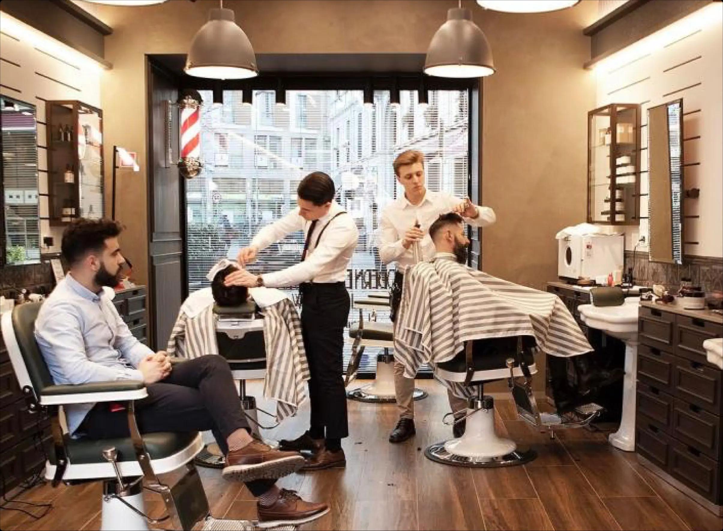 A welcoming barbershop with barbers at work